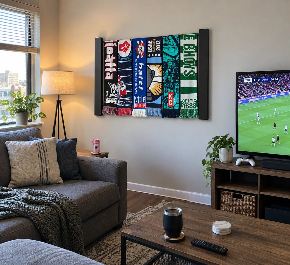 Chant rack in Black with scarves above a sofa in an apartment living room