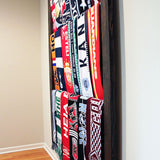 Bernabeu Soccer Scarf Display Rack: Side view of wooden rack with neatly arranged scarves.